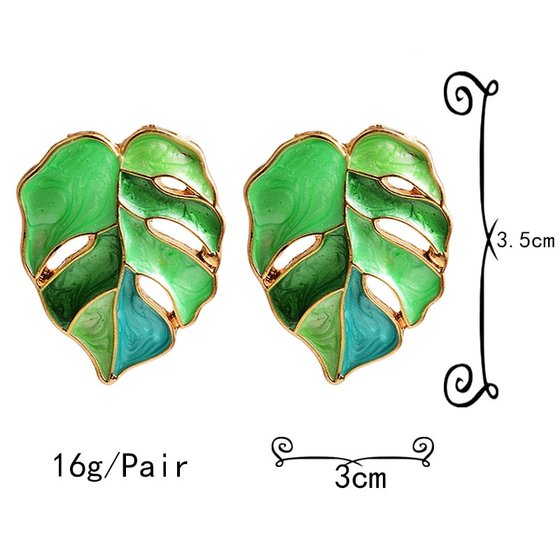 Variegated Monstera Leaf Post Earrings  Metal: Zinc Alloy  Available Color Options: Green, Pink, Purple, Yellow