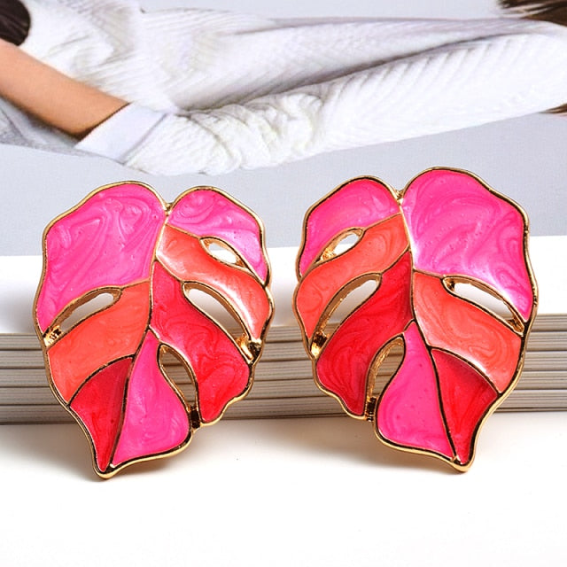 Variegated Monstera Leaf Post Earrings  Metal: Zinc Alloy  Available Color Options: Green, Pink, Purple, Yellow